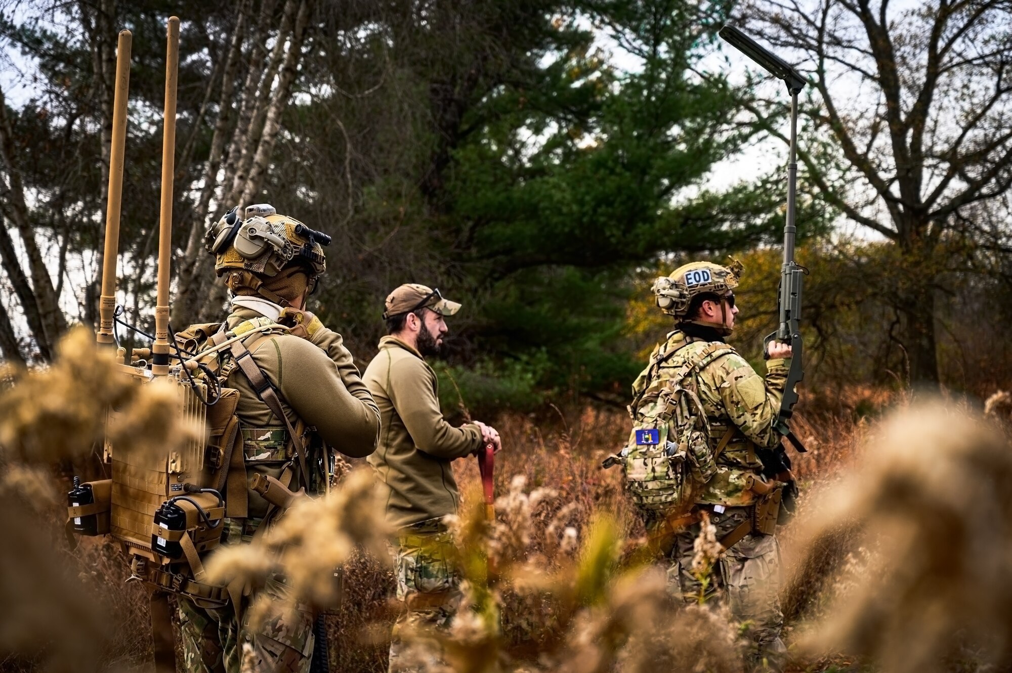 U.S. Air Force Staff. Sgt. Jonathan Riddensdale, Staff Sgt. Justin Sommer, and Senior Airman Jacob Albright, 87th Civil Engineer Squadron explosive ordnance disposal technicians, perform a sweep at Joint Base McGuire-Dix-Lakehurst, N.J., Nov. 14, 2024. The 87th CES EOD underwent a four-day training involving three teams of three technicians who worked through 20 intricate scenarios as part of an annual training qualification. (U.S. Air Force photo by Senior Airman Matt Porter)