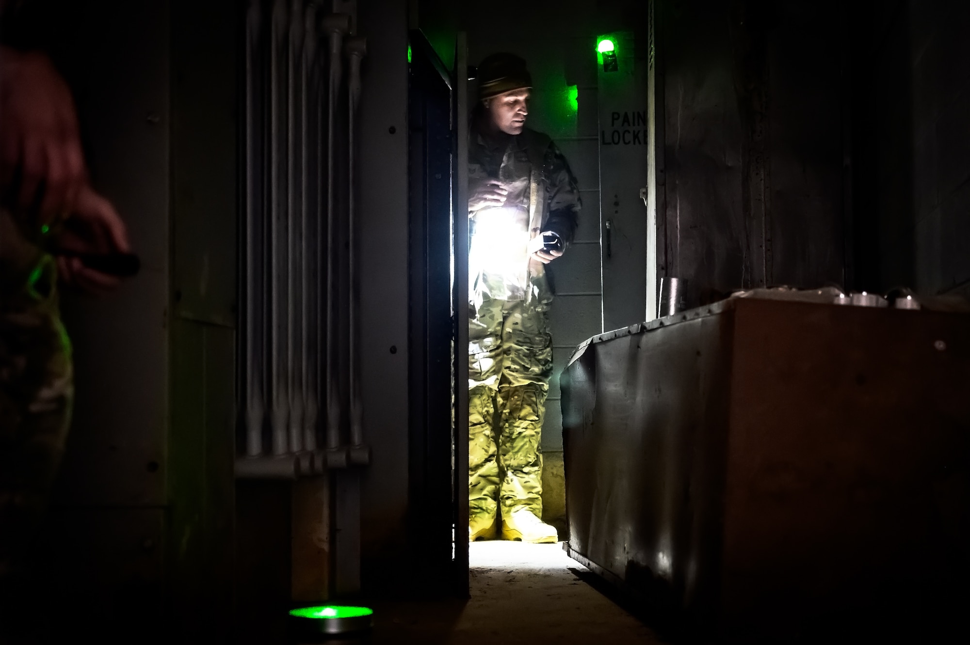 U.S. Air Force Tech. Sgt. Christopher Tolley, 87th Civil Engineer Squadron explosive ordnance disposal technician, sets up a laser tripwire at Joint Base McGuire-Dix-Lakehurst, N.J., Nov. 15, 2024. The 87th CES EOD unit underwent a four-day training involving three teams of three technicians who worked through 20 intricate scenarios as part of an annual training qualification. (U.S. Air Force photo by Senior Airman Matt Porter)