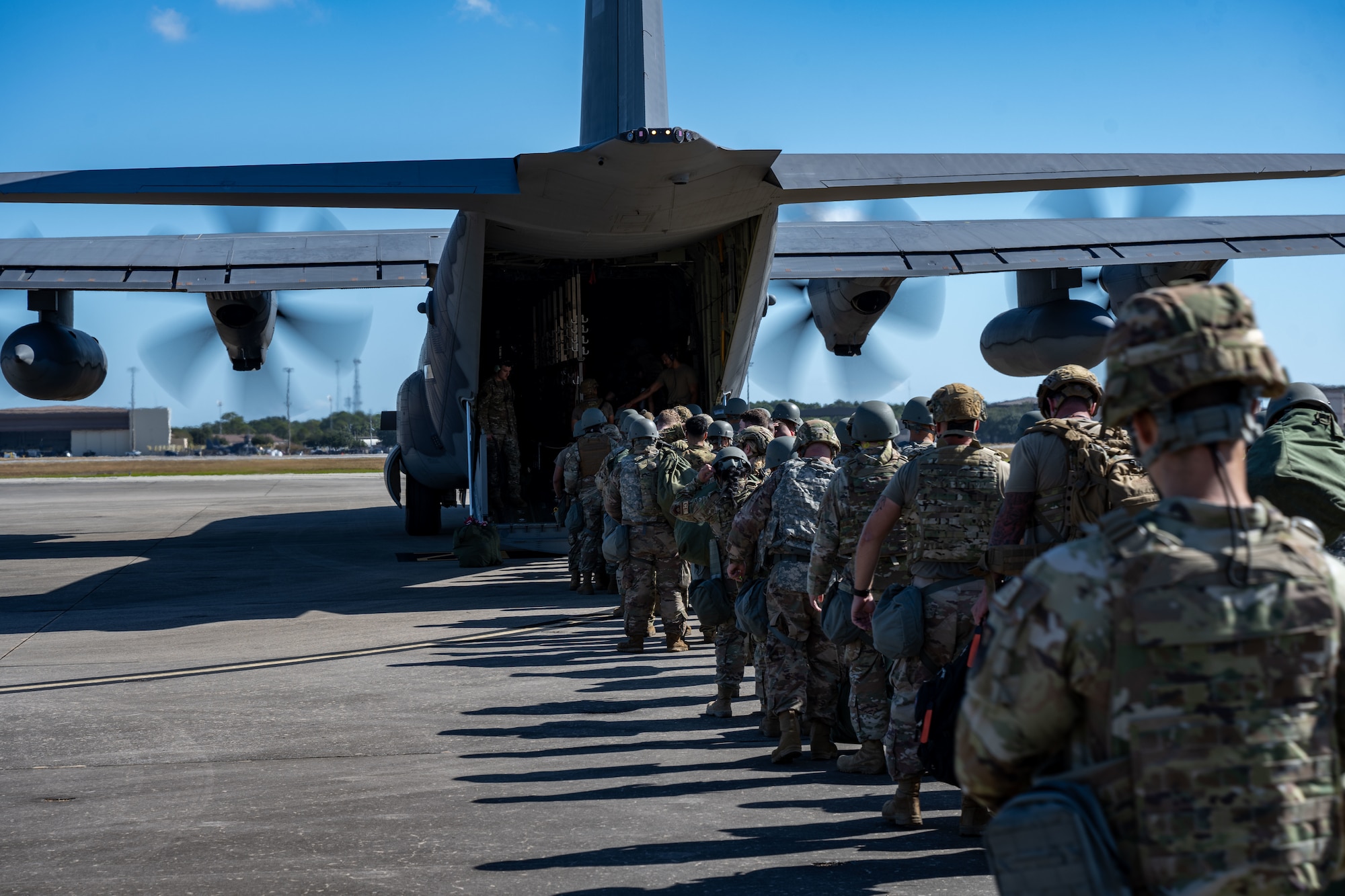 U.S. Airmen, assigned to the 1st Special Operations Mission Support Group, board a 15st Special Operations Squadron MC-130J Commando II during a bivouac exercise at Hurlburt Field, Florida, Nov 4, 2024. During the exercise, participants honed their skills in tactical operations, including weapons handling, tactical combat casualty Care, dismounted patrols, and operational security, while demonstrating their ability to survive and operate in an austere environment. (U.S. Air Force photo by Senior Airman Hussein Enaya)