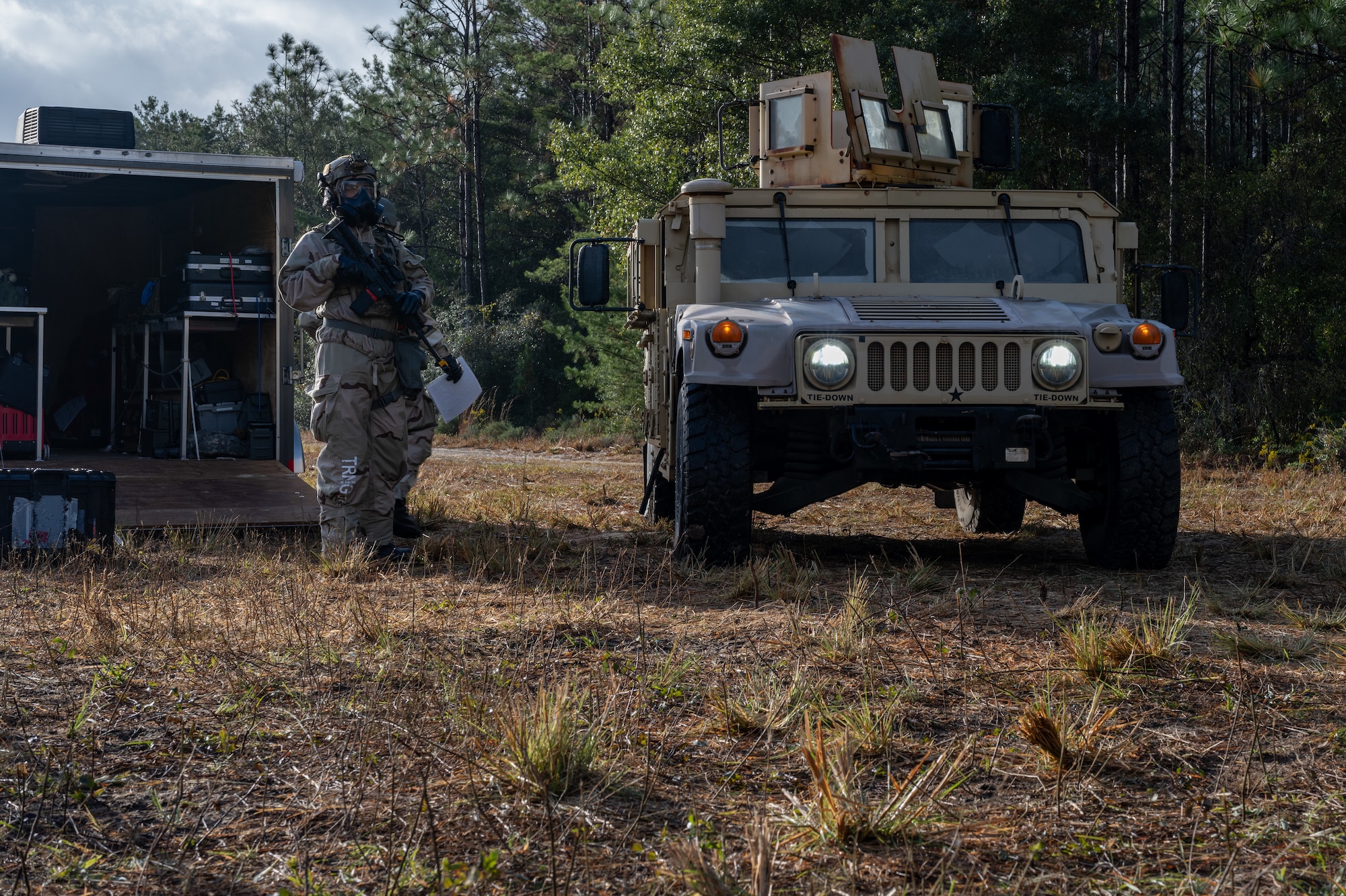 A U.S. Airman, assigned to the 1st Special Operations Mission Support Group, stands guard during a bivouac exercise at Eglin Range, Eglin Air Force Base, Florida, Nov. 5, 2024. The four-day exercise simulated the establishment and defense of a base in foreign territory to better prepare Airmen to deploy anytime, anywhere. (U.S. Air Force photo by Senior Airman Hussein Enaya)