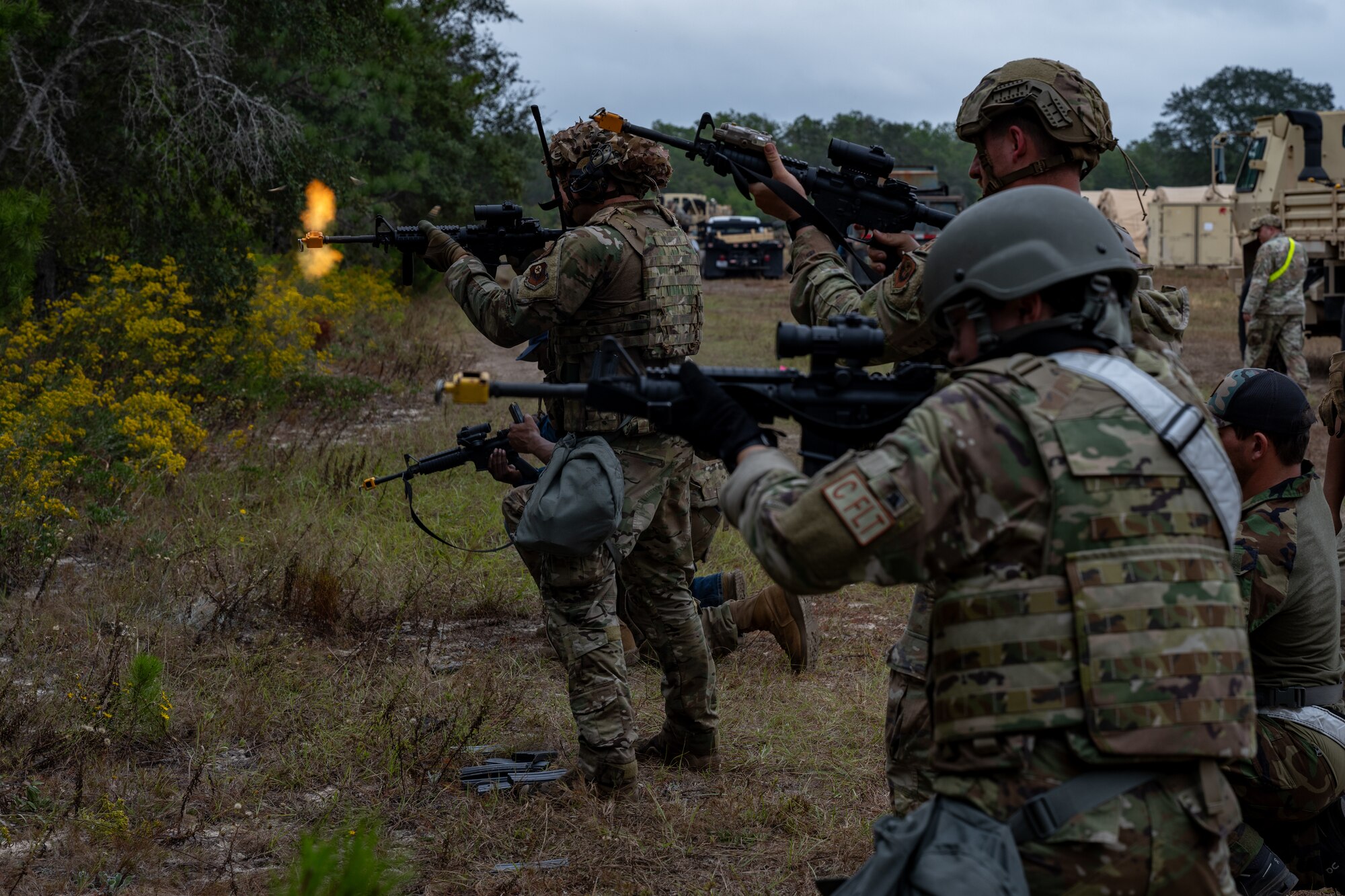 U.S. Airmen, assigned to Hurlburt Field, open fire during a bivouac exercise at Eglin Range, Eglin Air Force Base, Florida, Nov. 6, 2024. The bivouac exercise consisted of installing a temporary base in contested territory, training Airmen in multiple skills, such as operational security and the ability to survive and operate in a hostile environment ensuring readiness anytime, anywhere. (U.S. Air Force photo by Senior Airman Hussein Enaya)