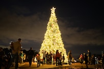 Families mix and mingle around the holiday tree, Nov. 30, 2023 Joint Base San Antonio-Randolph, Texas.