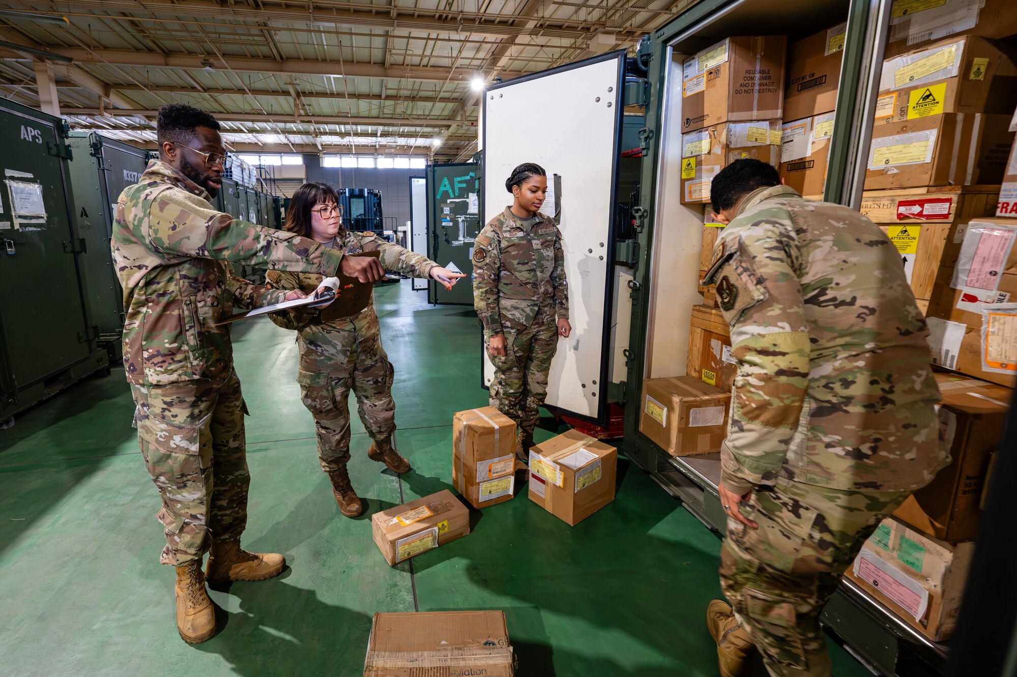 Airmen assigned to the 374th Logistics Readiness Squadron conduct an inventory of aircraft maintenance items for Operation Christmas Drop 2024 at Yokota Air Base, Japan.