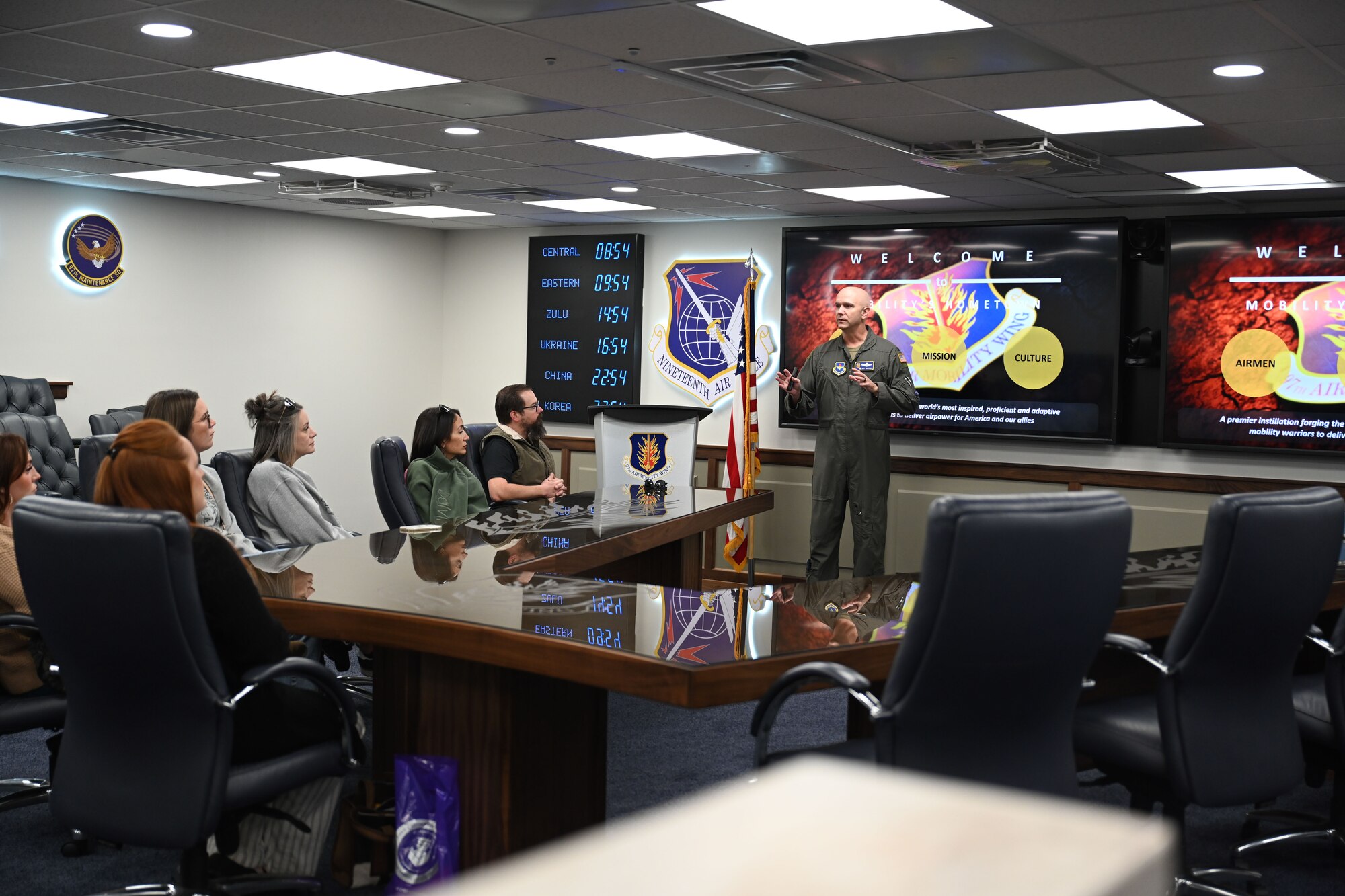 U.S. Air Force Col. Jeff Marshall, 97th Air Mobility Wing commander, briefs teachers from Southwest Oklahoma on the wing’s mission at Altus Air Force Base (AFB), Oklahoma, Nov. 21, 2024. Twenty-four teachers from 11 schools around Southwest Oklahoma experienced the wing’s mission firsthand during a KC-135 Stratotanker aircraft flight. (U.S. Air Force photo by Airman 1st Class Jonah Bliss)