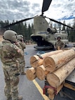 California Army National Guard Soldiers prepare to fly after sling-loading timber that will be used to conserve a cultural site in the Stanislaus National Forest Oct. 30, 2024. The Stanislaus collaborated with the 1-126th Aviation Regiment, Cal Guard, to deliver critical supplies to remote forest areas near Cooper Meadow in the Emigrant Wilderness.