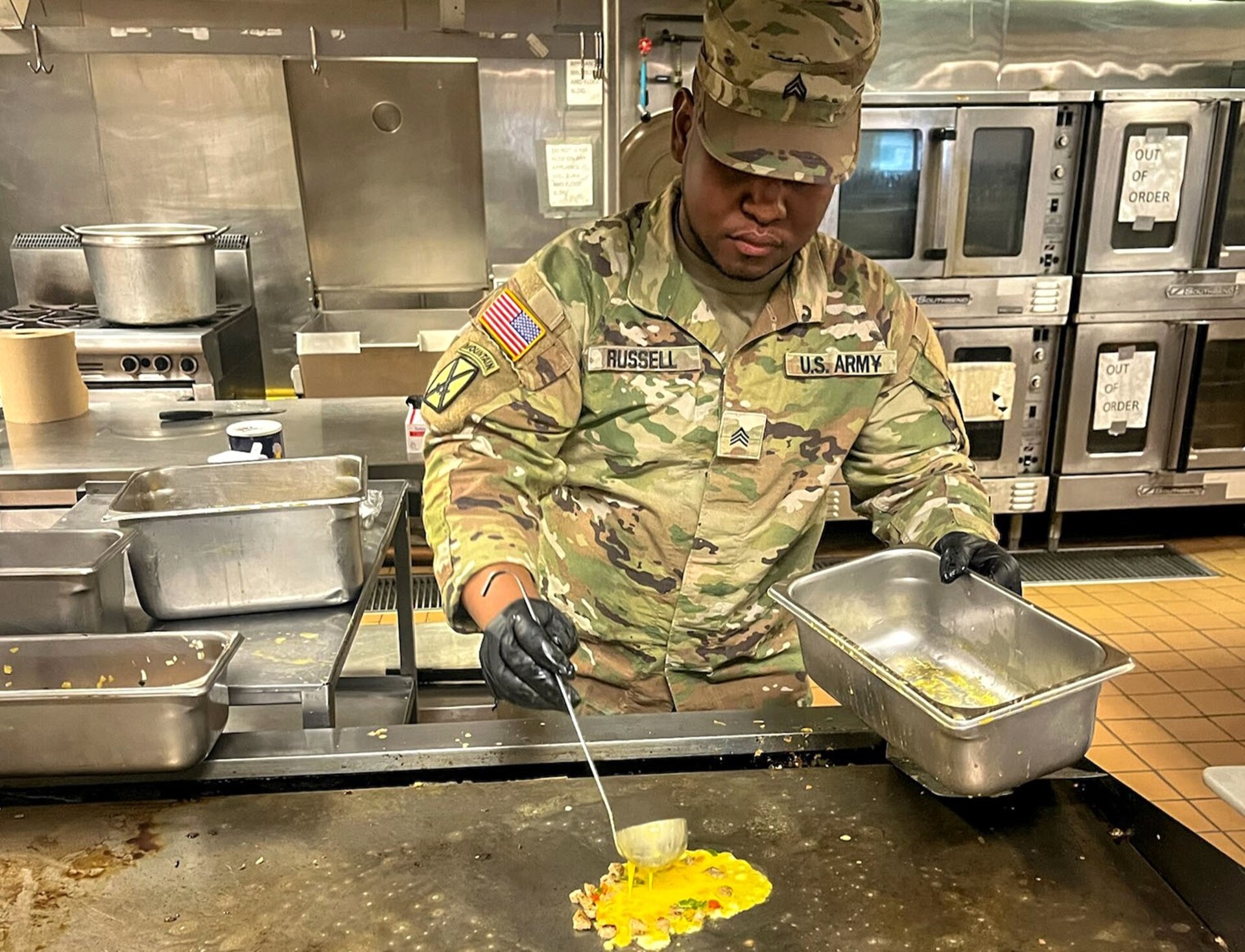 New York Army National Guard Sgt. Jaleel Russell with the 1501st Quartermaster Company (Field Feeding), 369th Sustainment Brigade, fries an egg omelette during the 42nd Infantry Division’s command post exercise at Fort Indiantown Gap, Pa., Nov. 24, 2024. This was the 1501st FFC’s first official large-scale support mission. (U.S. Army National Guard photo by 2nd Lt. Rivkah Weissberger)