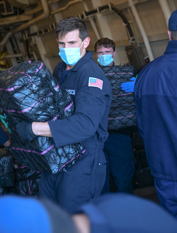 Crewmembers from Coast Guard Cutter Hamilton offload bales of interdicted narcotics in Port Everglades, Florida, Dec. 2, 2024. Hamilton’s crew offloaded more than 16,100 pounds of cocaine worth an assessed street value of approximately $182.8 million that the Coast Guard and its partners intercepted in the international waters of the Eastern Pacific Ocean. (U.S. Coast Guard photo by Petty Officer 3rd Class Eric Rodriguez)