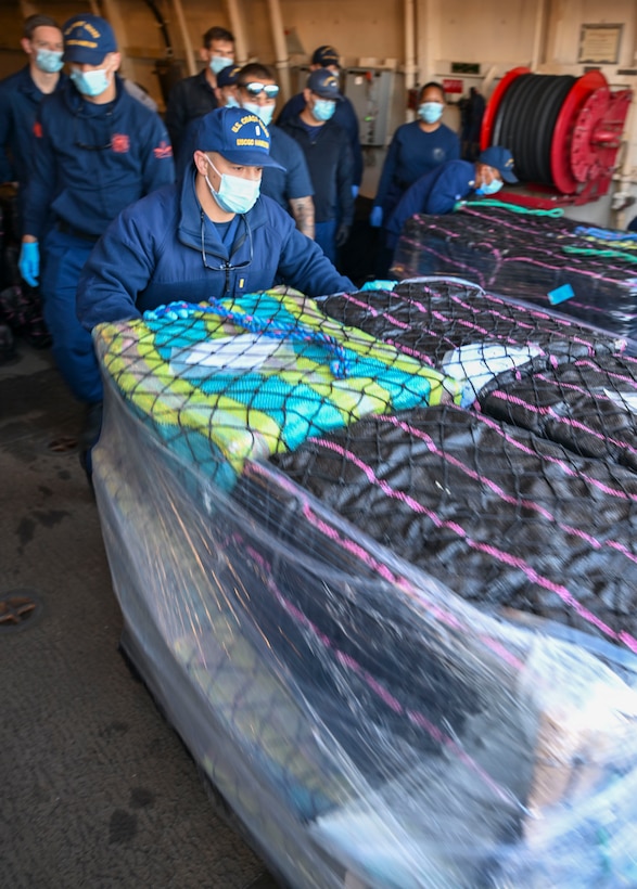 Crewmembers from Coast Guard Cutter Hamilton offload bales of interdicted narcotics in Port Everglades, Florida, Dec. 2, 2024. Hamilton’s crew offloaded more than 16,100 pounds of cocaine worth an assessed street value of approximately $182.8 million that the Coast Guard and its partners intercepted in the international waters of the Eastern Pacific Ocean. (U.S. Coast Guard photo by Petty Officer 3rd Class Eric Rodriguez)