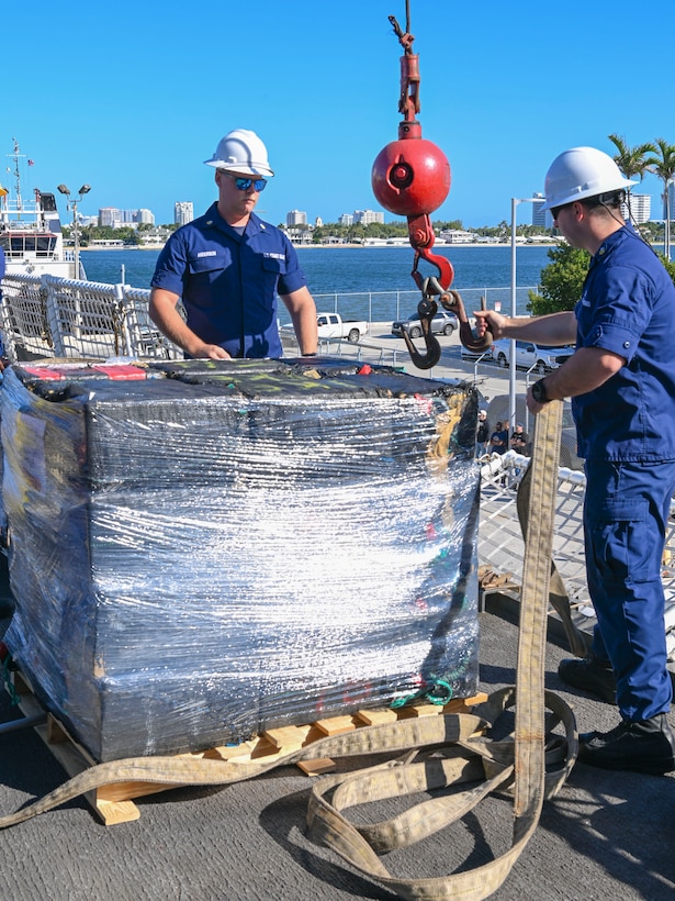 Crewmembers from Coast Guard Cutter Hamilton offload bales of interdicted narcotics in Port Everglades, Florida, Dec. 2, 2024. Hamilton’s crew offloaded more than 16,100 pounds of cocaine worth an assessed street value of approximately $182.8 million that the Coast Guard and its partners intercepted in the international waters of the Eastern Pacific Ocean. (U.S. Coast Guard photo by Petty Officer 3rd Class Eric Rodriguez)