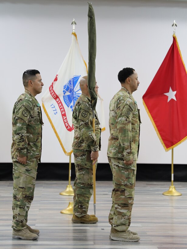 Leaders of the 606th Quartermaster Detachment case the unit guidon