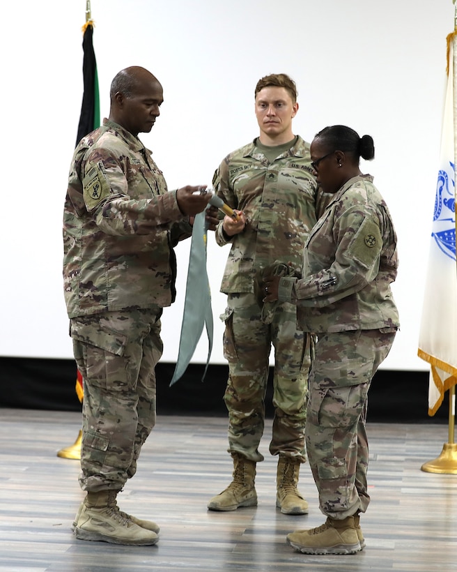 Leaders case their unit colors on stage.