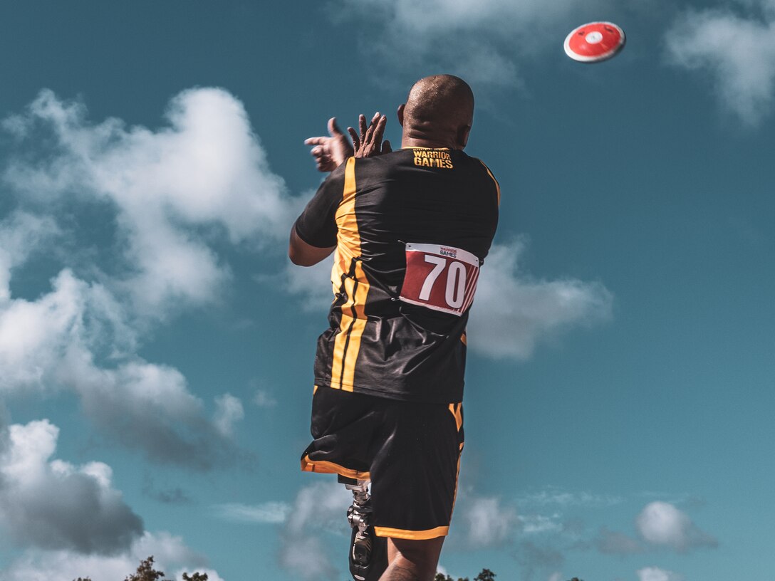 U.S. Army veteran Gene Calantoc throws the discus at the field event during the 2024 Department of Defense Warrior Games