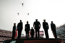 U.S. service members stand at attention during the national anthem before the San Francisco 49ers Salute to Service game vs. the Seattle Seahawks at Levi’s Stadium Santa Clara, California. Nov. 17, 2024. U.S. service members participated in the Salute to Service game to help honor the nation's service members, veterans and their families. (U.S. Marine Corps photo by Cpl. Sarah M. Grawcock)