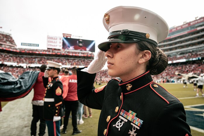U.S. Marine Corps Sgt. Marissa Escobedo, administrative specialist, with 23rd Marine Regiment, salutes the American Flag before the San Francisco 49ers Salute to Service game vs. the Seattle Seahawks at Levi’s Stadium Santa Clara, California. Nov. 17, 2024. U.S. Marines participated in the Salute to Service game to help honor the nation's service members, veterans and their families. (U.S. Marine Corps photo by Cpl. Sarah M. Grawcock)