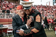 U.S. Marine Corps Master Gunnery Sgt. Thomas Wallace, with Recruiting Station San Francisco,12th Marine Corps District, hugs a retired Marine before the San Francisco 49ers Salute to Service game vs. the Seattle Seahawks at Levi’s Stadium Santa Clara, California. Nov. 17, 2024. U.S. service members participated in the Salute to Service game to help honor the nation's service members, veterans and their families. (U.S. Marine Corps photo by Cpl. Sarah M. Grawcock)