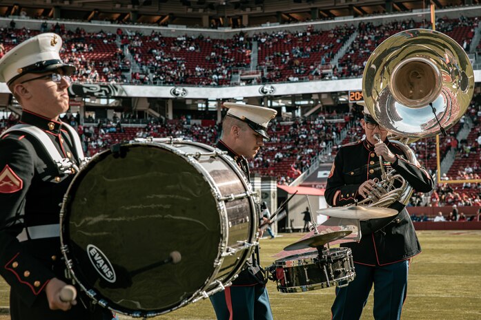 U.S. Marine Corps Sgt. Bryan Lester, right, Cpl. Benjamin Steinquest, center, and Lance Cpl. Jesse Powers, left, all with Marine Band San Diego, perform during the pregame show before the San Francisco 49ers Salute to Service game vs. the Seattle Seahawks at Levi’s Stadium Santa Clara, California. Nov. 17, 2024. The Marine Band San Diego participated in the Salute to Service game to help honor the nation's service members, veterans and their families. (U.S. Marine Corps photo by Cpl. Sarah M. Grawcock)