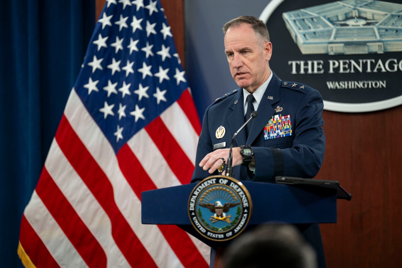 A man speaks from a podium.