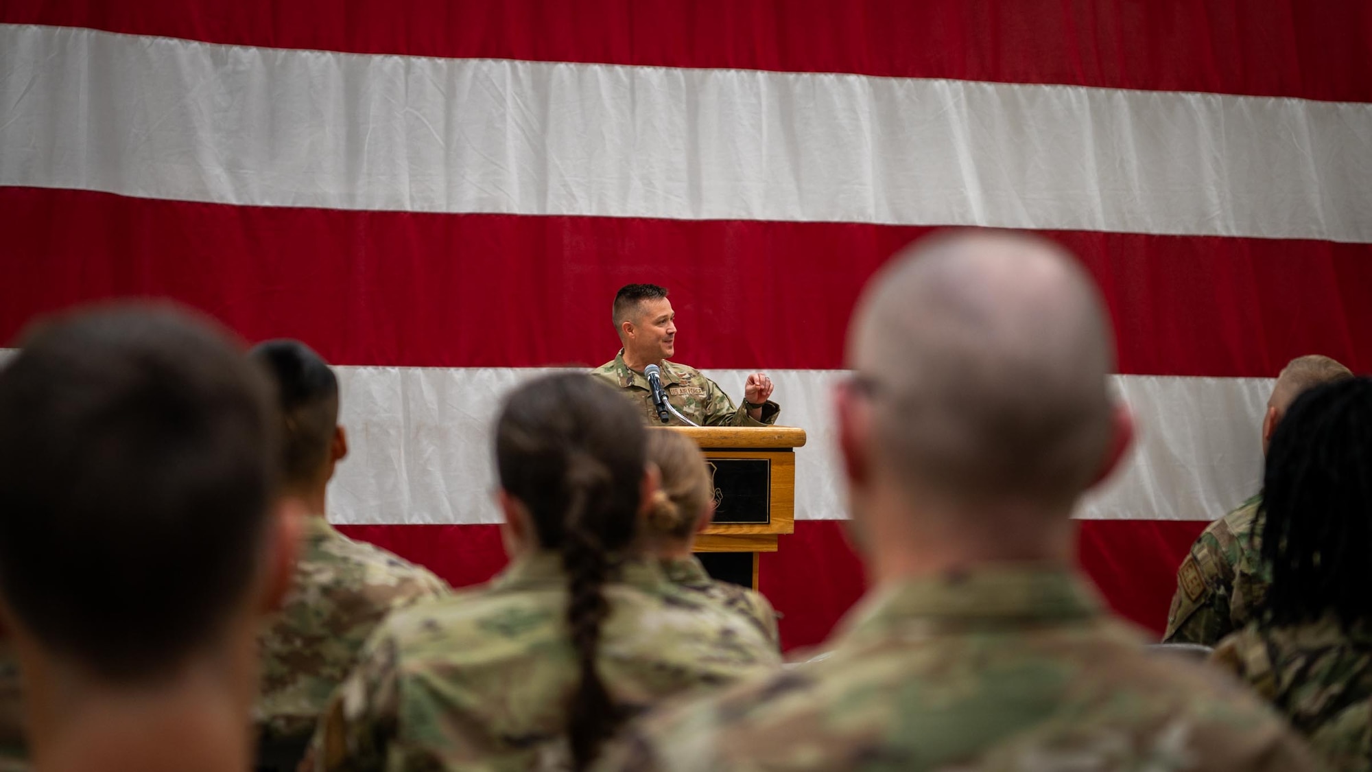 944th Fighter Wing Commander Col. Todd Riddle addresses Reserve Citizen Airmen during a Ready Start Brief as part of Exercise Desert Hammer 25-1 at Luke Air Force Base, Ariz., Nov. 13, 2024. This large-scale exercise showcases the adaptability of Mission Ready Airmen, advancing the skills needed to thrive in the rapidly evolving challenges of global competition. (U.S. Air Force photo by Senior Airman Jacob Dastas)