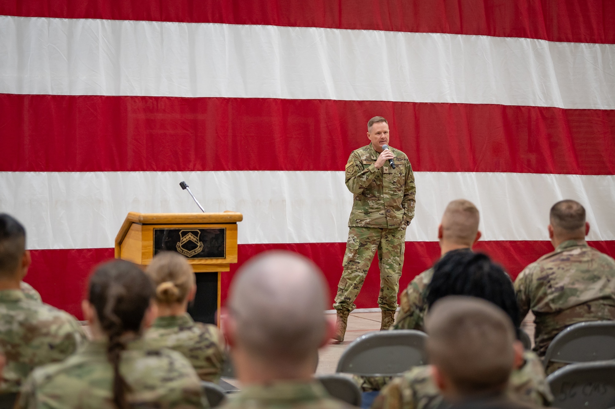 Col. Chad Burdick, 944th Fighter Wing Air Task Force Commander for Desert Hammer, addresses Reserve Citizen Airmen during a Ready Start Brief at Luke Air Force Base, Ariz., Nov. 13, 2024. This large-scale exercise showcases the adaptability of Mission Ready Airmen, advancing the skills needed to thrive in the rapidly evolving challenges of global competition. (U.S. Air Force photo by Tech. Sgt. Tyler J. Bolken)