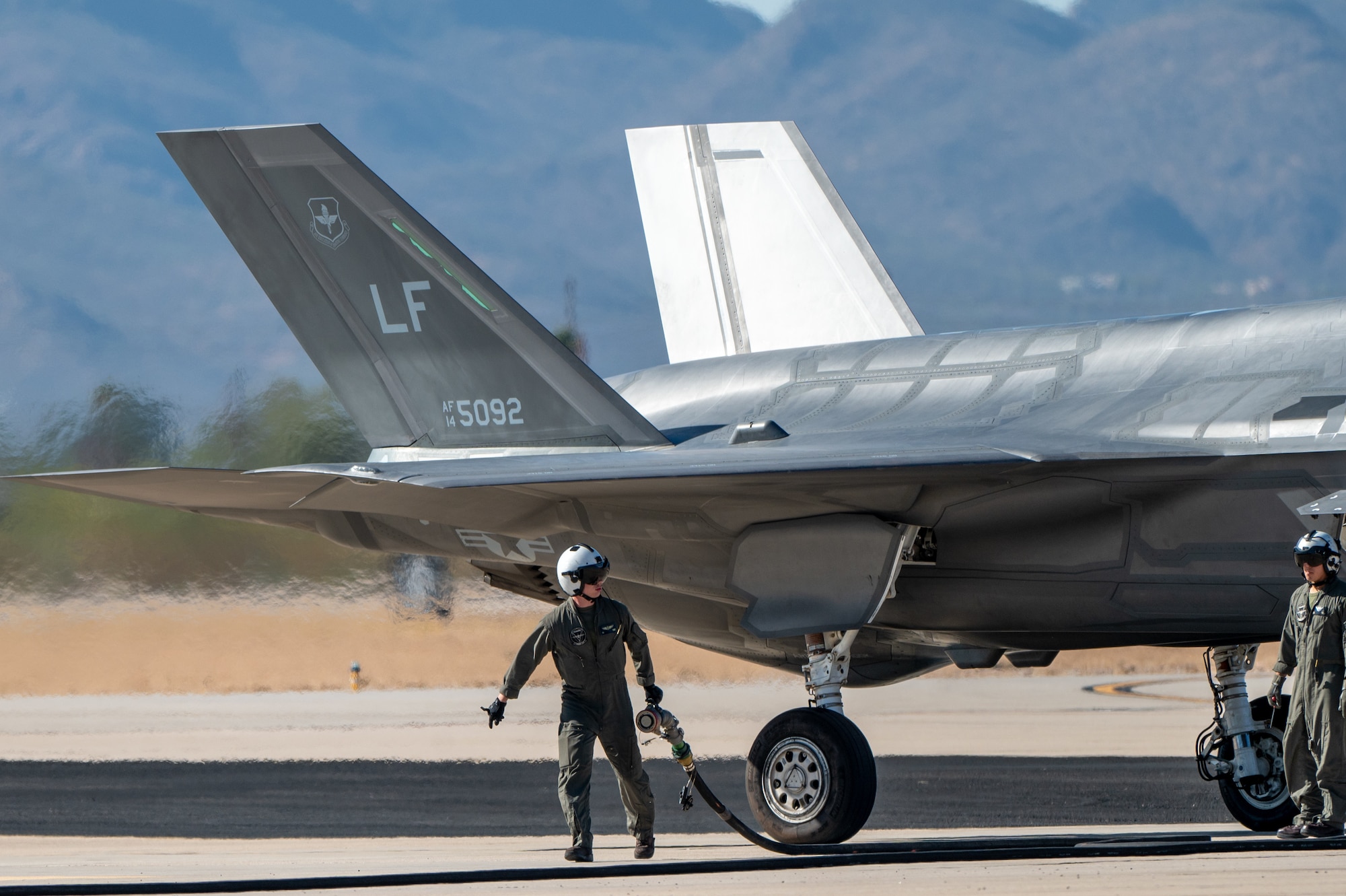 U.S. Marines refuel an F-35 Lightning II aircraft, assigned to the 56th Fighter Wing’s 62nd Fighter Squadron, on the flightline at Davis-Monthan Air Force Base, Ariz., Nov. 14, 2024. The Marines and F-35s participated in Exercise Desert Hammer 25-1, to include a forward area refueling point training. (U.S. Air Force photo by Senior Airman Devlin Bishop)