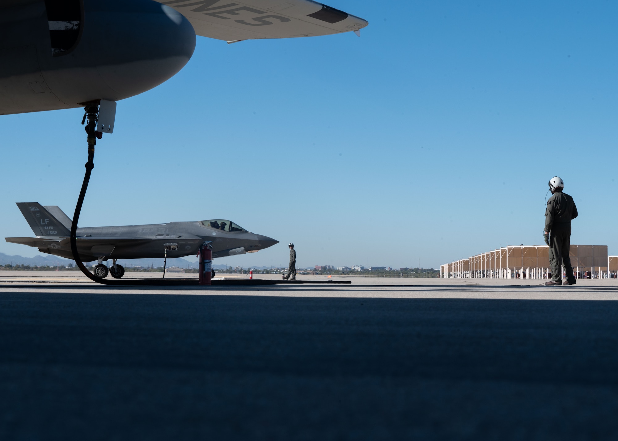 U.S. Marines refuel an F-35 Lightning II aircraft, assigned to the 56th Fighter Wing’s 62nd Fighter Squadron, on the flightline at Davis-Monthan Air Force Base, Arizona, Nov. 14, 2024. The Marines and F-35s participated in Exercise Desert Hammer 25-1, to include a forward area refueling point training. (U.S. Air Force photo by Senior Airman William Finn V)