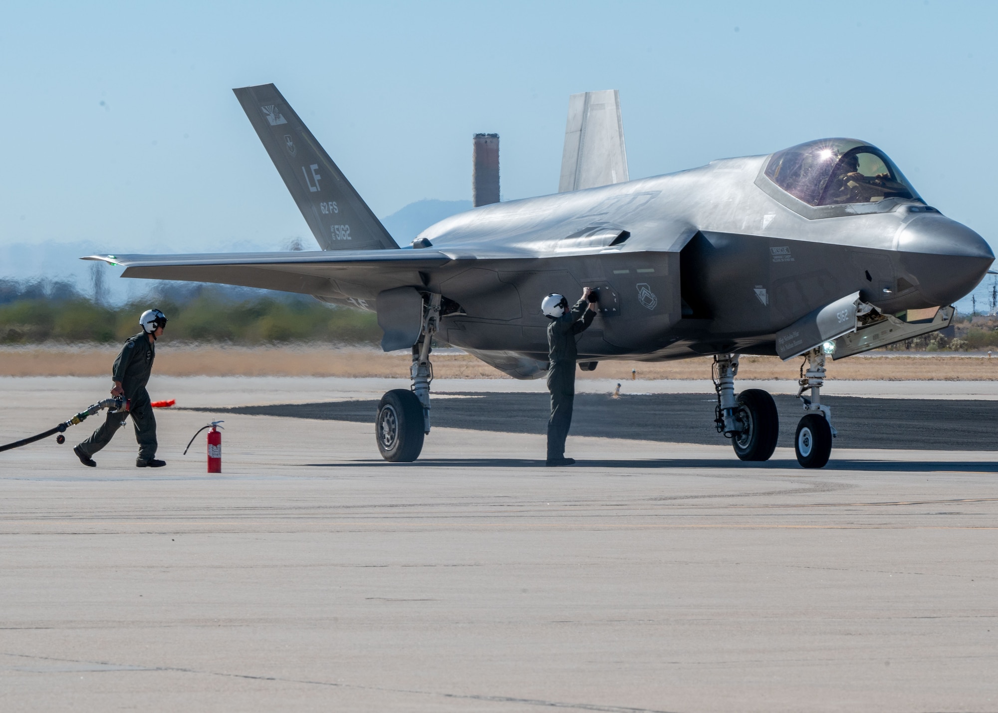 U.S. Marines refuel an F-35 Lightning II aircraft, assigned to the 56th Fighter Wing’s 62nd Fighter Squadron, on the flightline at Davis-Monthan Air Force Base, Arizona, Nov. 14, 2024. The Marines and F-35s participated in Exercise Desert Hammer 25-1, to include a forward area refueling point training. (U.S. Air Force photo by Senior Airman William Finn V)