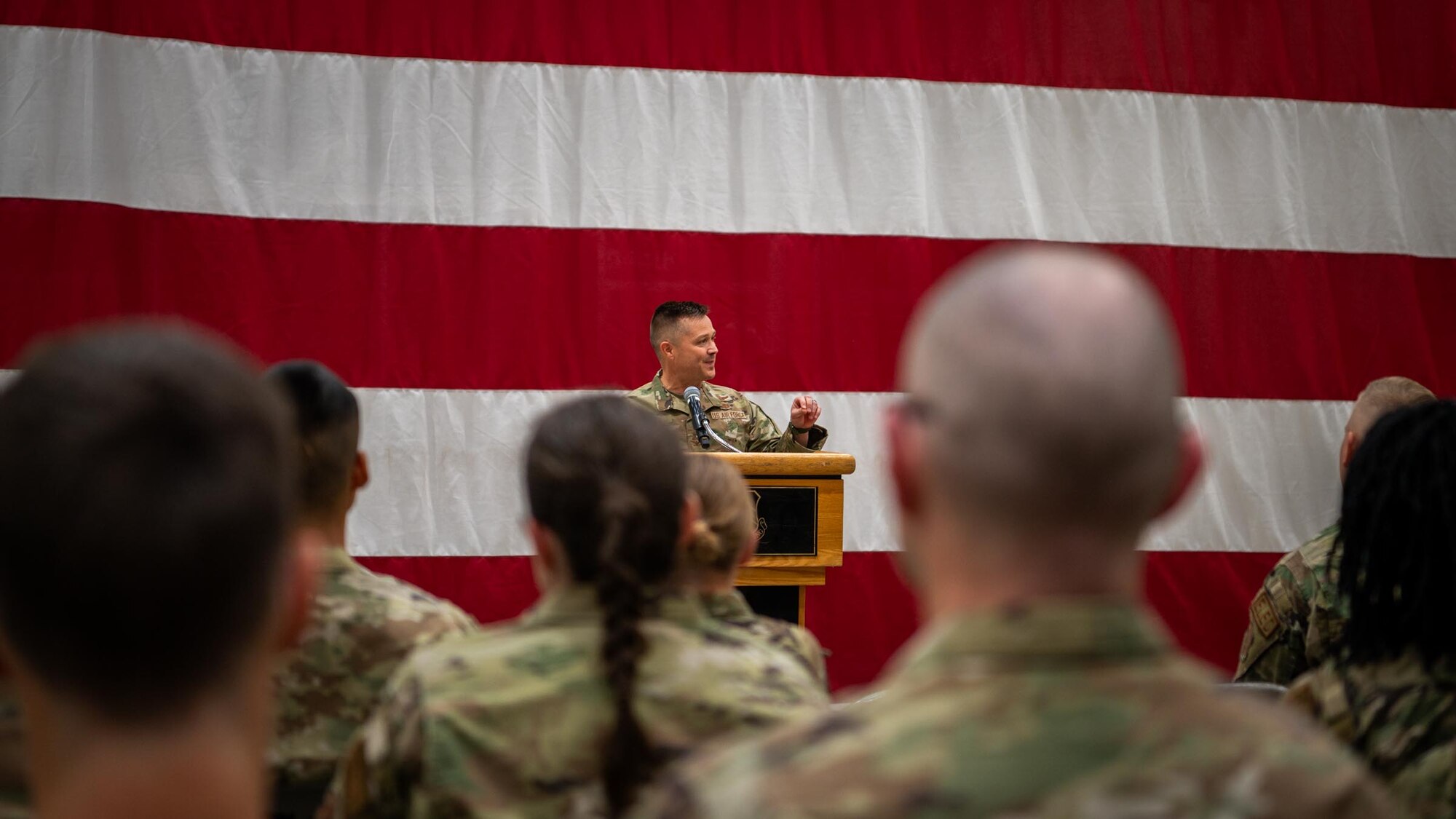 944th Fighter Wing Commander Col. Todd Riddle addresses Reserve Citizen Airmen during a Ready Start Brief as part of Exercise Desert Hammer 25-1 at Luke Air Force Base, Ariz., Nov. 13, 2024. This large-scale exercise showcases the adaptability of Mission Ready Airmen, advancing the skills needed to thrive in the rapidly evolving challenges of global competition. (U.S. Air Force photo by Senior Airman Jacob Dastas)