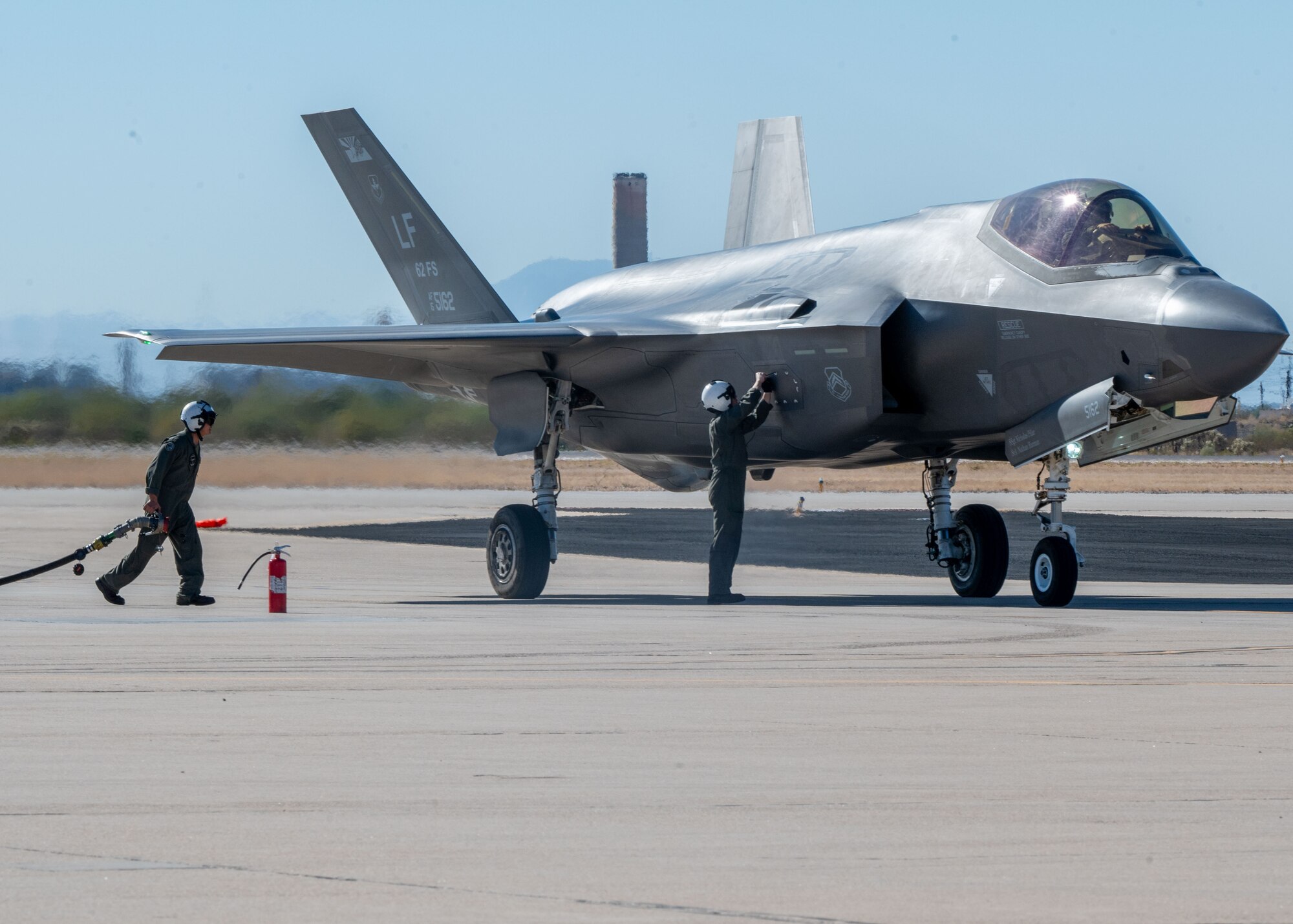 U.S. Marines refuel an F-35 Lightning II aircraft, assigned to the 56th Fighter Wing’s 62nd Fighter Squadron, on the flightline at Davis-Monthan Air Force Base, Arizona, Nov. 14, 2024. The Marines and F-35s participated in Exercise Desert Hammer 25-1, to include a forward area refueling point training. (U.S. Air Force photo by Senior Airman William Finn V)