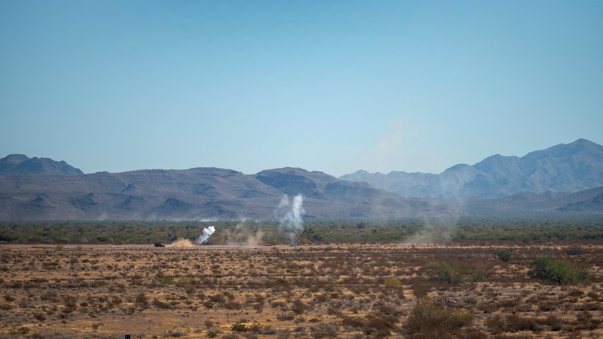 Smoke rises from a simulated target after being engaged by an A-10 Thunderbolt II from the 924th Fighter Group of the 944th Fighter Wing during Exercise Desert Hammer 25-1 at Barry M. Goldwater Range East near Gila Bend, Ariz., Nov. 14, 2024. Exercise Desert Hammer 25-1 emphasizes the U.S. Air Force Reserve’s commitment to readiness by integrating Agile Combat Support and Large Force Exercise capabilities in a contested environment. (U.S. Air Force photo by Senior Airman Jacob Dastas)