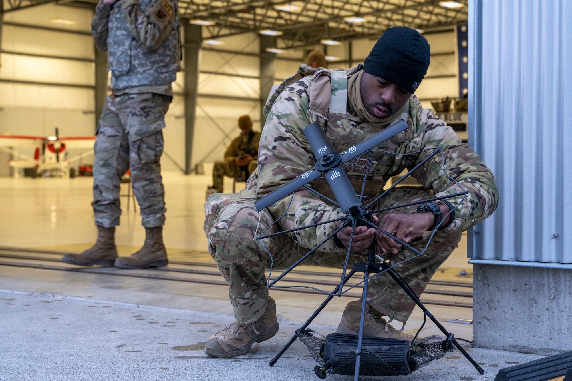 A man adjusts an antenna