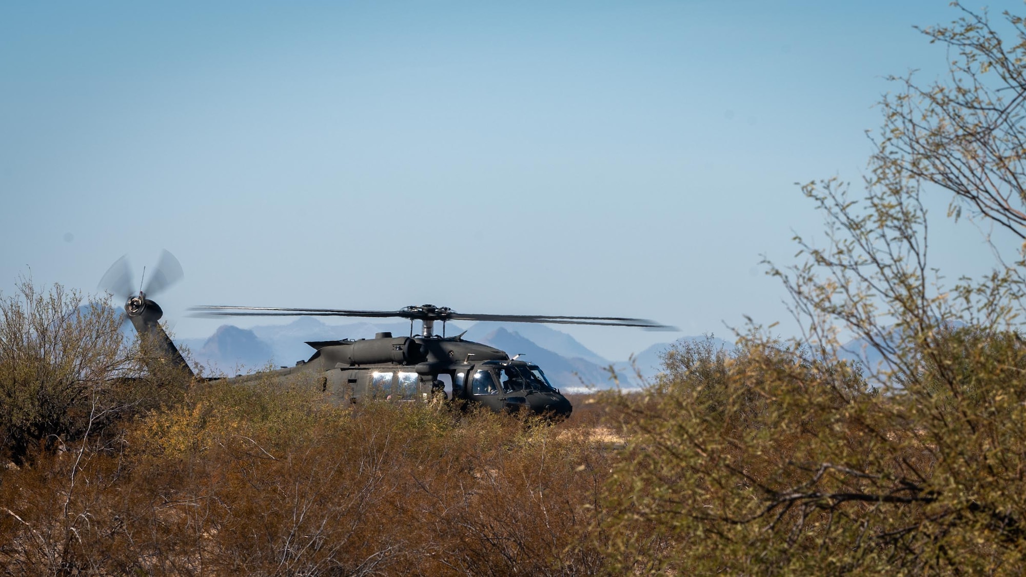 A UH-60 Black Hawk from the Arizona Army National Guard prepares for landing during Exercise Desert Hammer 25-1 at Auxiliary Airfield 6 near Gila Bend, Ariz., Nov. 14, 2024. Set against the unmatched backdrop of the Barry M. Goldwater Range, Desert Hammer leverages Arizona’s strategic geography to provide realistic combat training for U.S. and allied forces. (U.S. Air Force photo by Senior Airman Jacob Dastas)