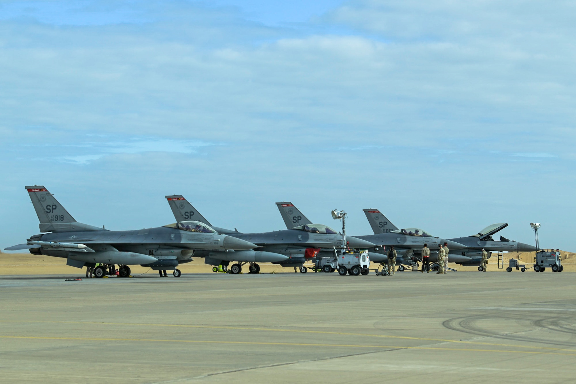 Two U.S. Air Force F-16 Fighting Falcons prepare to launch for a training mission during Exercise PHOENIX ARMOR in a U.S. Central Command area of responsibility, Nov. 26, 2024.