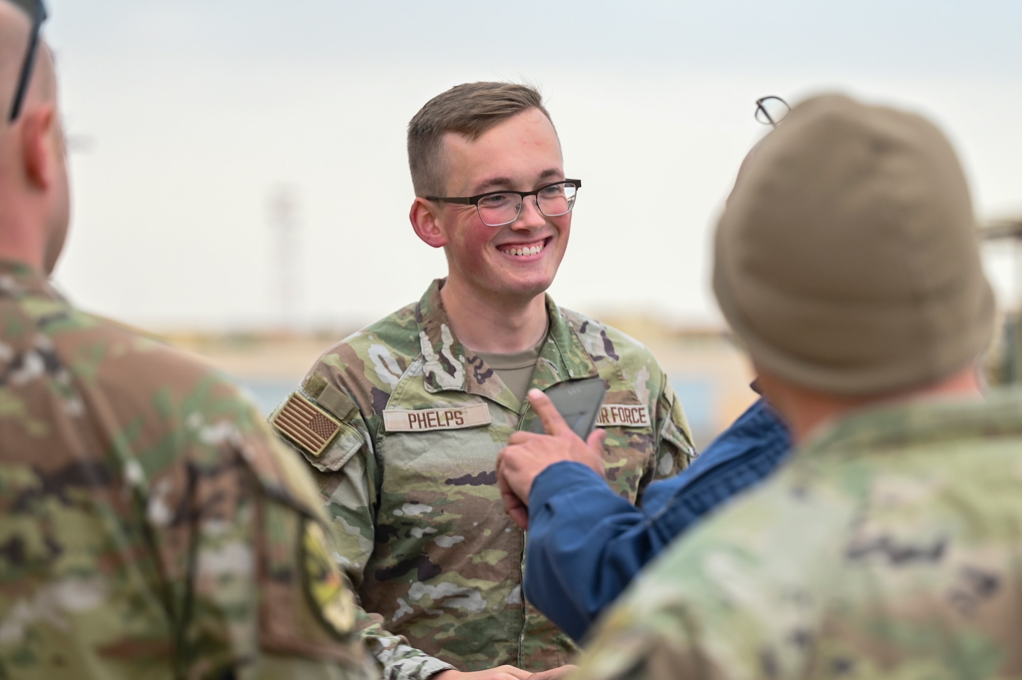 U.S. Air Force Senior Airman Roland Phelps, 378th Air Expeditionary Wing Host Nation Coordination Cell cryptologic language analyst, translates between U.S. Air Force and coalition partners in a U.S. Central Command area of responsibility, Nov. 26, 2024.