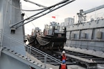 Mid-Atlantic Regional Maintenance Center (MARMC) floating dry-dock Dynamic (AFDL 6) conducts a double docking evolution of Joint Expeditionary Base-Little Creek port operations work boats