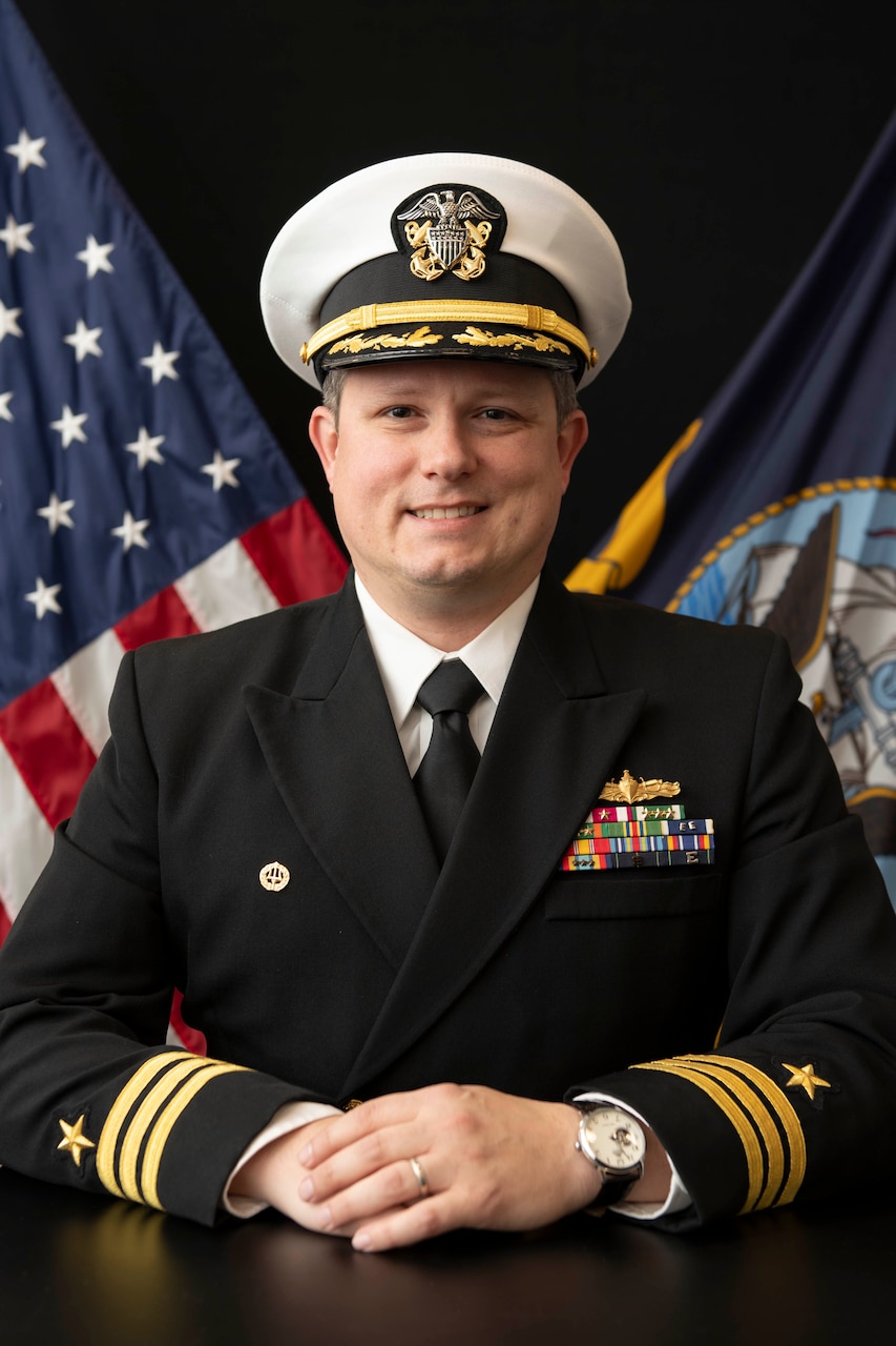 Cmdr. ROBERT L. FOSTER