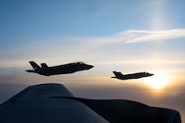 F-35s fly next to B-52.