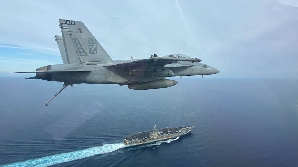 An F/A-18F Super Hornet from VFA-11 flies past USS Harry S. Truman (CVN 75) in the Mediterranean Sea.