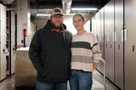 Mr. John Pick, left, and his wife Amanda share a passion to honor America’s deceased service members every holiday season through their volunteer work with Wreaths Across America.  Both serve aboard Naval Health Clinic Cherry Point, John as a General Schedule Financial Technician and Amanda as a contracted Supply Technician.