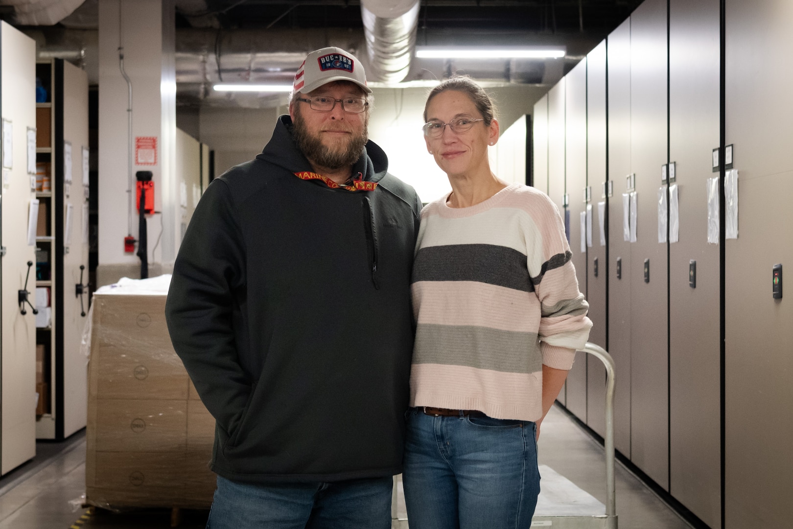 Mr. John Pick, left, and his wife Amanda share a passion to honor America’s deceased service members every holiday season through their volunteer work with Wreaths Across America.  Both serve aboard Naval Health Clinic Cherry Point, John as a General Schedule Financial Technician and Amanda as a contracted Supply Technician.