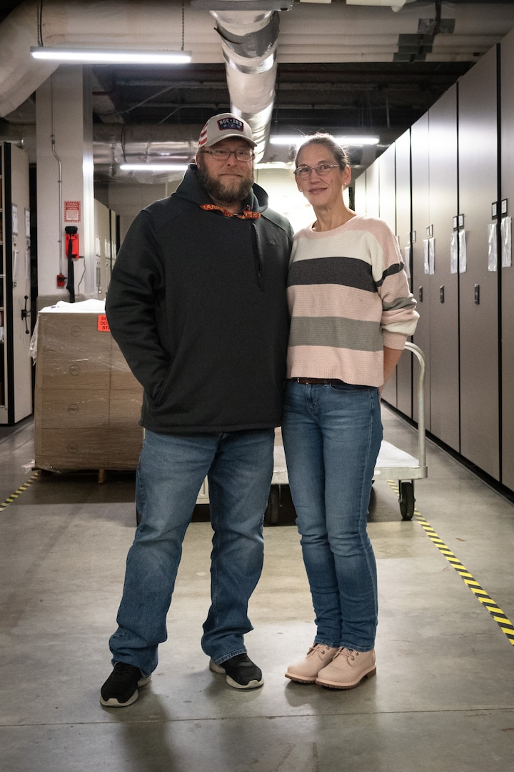 Mr. John Pick, left, and his wife Amanda share a passion to honor America’s deceased service members every holiday season through their volunteer work with Wreaths Across America.  Both serve aboard Naval Health Clinic Cherry Point, John as a General Schedule Financial Technician and Amanda as a contracted Supply Technician.