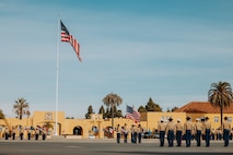U.S. Marines with the Recruit Training Regiment color guard present the colors at a graduation ceremony for Golf Company, 2nd Recruit Training Battalion, at Marine Corps Recruit Depot San Diego, California, Nov. 26, 2024. Graduation took place at the completion of the 13-week transformation, which included training for drill, marksmanship, basic combat skills, and Marine Corps customs and traditions. (U.S. Marine Corps photo by Cpl. Alexander O. Devereux)