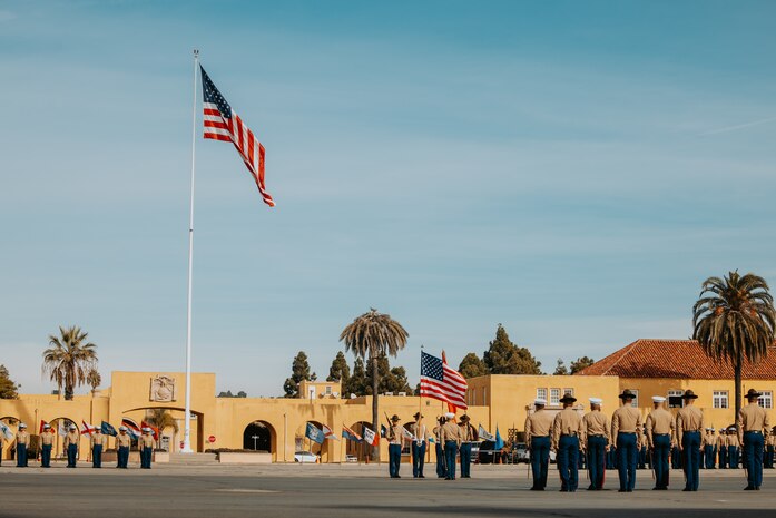 U.S. Marines with the Recruit Training Regiment color guard present the colors at a graduation ceremony for Golf Company, 2nd Recruit Training Battalion, at Marine Corps Recruit Depot San Diego, California, Nov. 26, 2024. Graduation took place at the completion of the 13-week transformation, which included training for drill, marksmanship, basic combat skills, and Marine Corps customs and traditions. (U.S. Marine Corps photo by Cpl. Alexander O. Devereux)