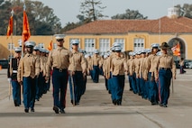 U.S. Marines with Golf Company, 2nd Recruit Training Battalion, march across the parade deck during their graduation ceremony at Marine Corps Recruit Depot San Diego, California, Nov. 26, 2024. Graduation took place at the completion of the 13-week transformation, which included training for drill, marksmanship, basic combat skills, and Marine Corps customs and traditions. (U.S. Marine Corps photo by Cpl. Alexander O. Devereux)