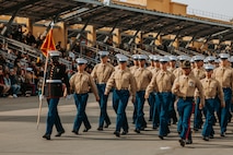 U.S. Marines with Golf Company, 2nd Recruit Training Battalion, march across the parade deck during their graduation ceremony at Marine Corps Recruit Depot San Diego, California, Nov. 26, 2024. Graduation took place at the completion of the 13-week transformation, which included training for drill, marksmanship, basic combat skills, and Marine Corps customs and traditions. (U.S. Marine Corps photo by Cpl. Alexander O. Devereux)
