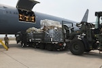 Crew offload humanitarian cargo from a KC-46A at Soto Cano Air Base, Honduras.