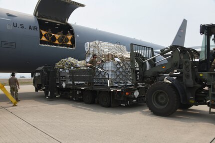 Crew offload humanitarian cargo from a KC-46A at Soto Cano Air Base, Honduras.
