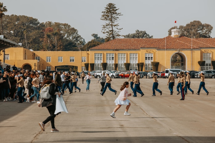 Families and guests of Golf Company, 2nd Recruit Training Battalion, run to greet their new Marines at the conclusion of a graduation ceremony at Marine Corps Recruit Depot San Diego, California, Nov. 26, 2024. Graduation took place at the completion of the 13-week transformation, which included training for drill, marksmanship, basic combat skills, and Marine Corps customs and traditions. (U.S. Marine Corps photo by Cpl. Alexander O. Devereux)