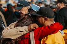 A new U.S. Marine from Golf Company, 2nd Recruit Training Battalion, is greeted by guests after a graduation ceremony at Marine Corps Recruit Depot San Diego, California, Nov. 26, 2024. Graduation took place at the completion of the 13-week transformation, which included training for drill, marksmanship, basic combat skills, and Marine Corps customs and traditions. (U.S. Marine Corps photo by Cpl. Alexander O. Devereux)