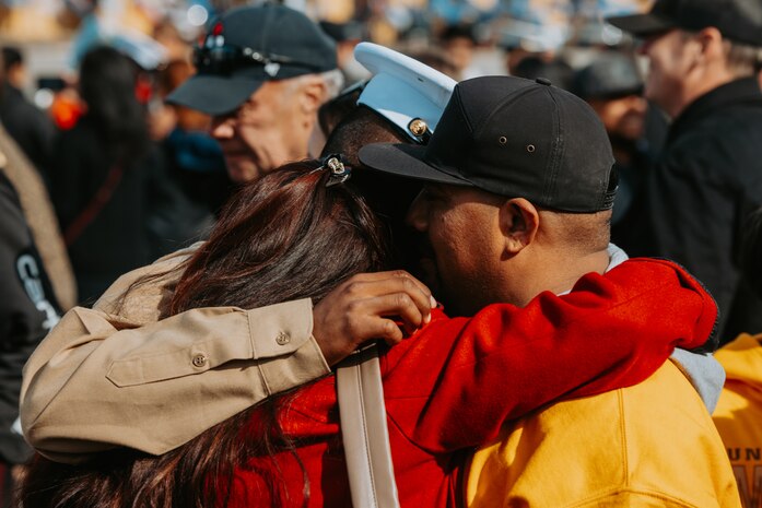 A new U.S. Marine from Golf Company, 2nd Recruit Training Battalion, is greeted by guests after a graduation ceremony at Marine Corps Recruit Depot San Diego, California, Nov. 26, 2024. Graduation took place at the completion of the 13-week transformation, which included training for drill, marksmanship, basic combat skills, and Marine Corps customs and traditions. (U.S. Marine Corps photo by Cpl. Alexander O. Devereux)