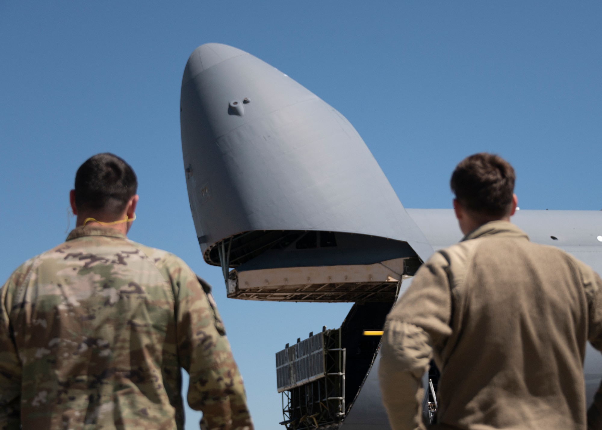 Airman watch and welcome their fellow Long Rangers back home after a deployment to Anderson AFB, Guam.